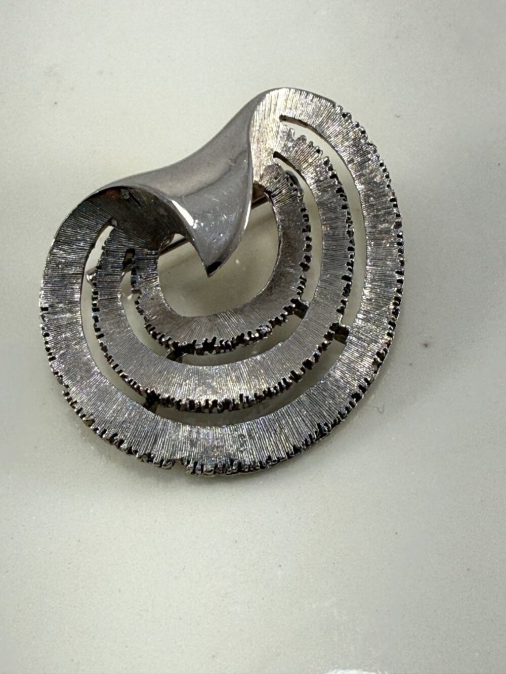Vintage JJ Jonette Jewelry Sculptural Swirl Brooch Pin Silver Tone Textured
